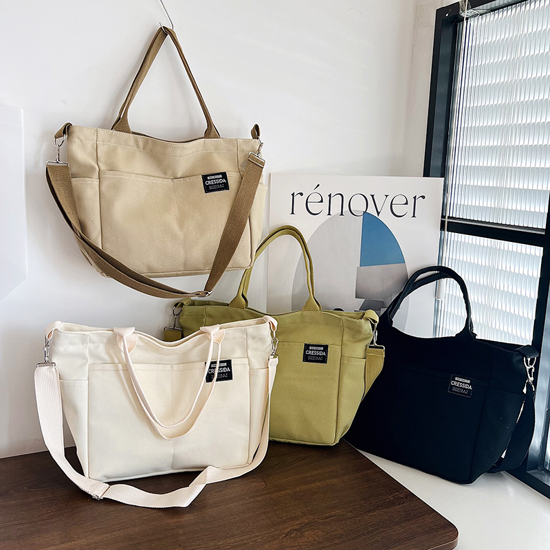 意琳宝厚帆布书包海外款