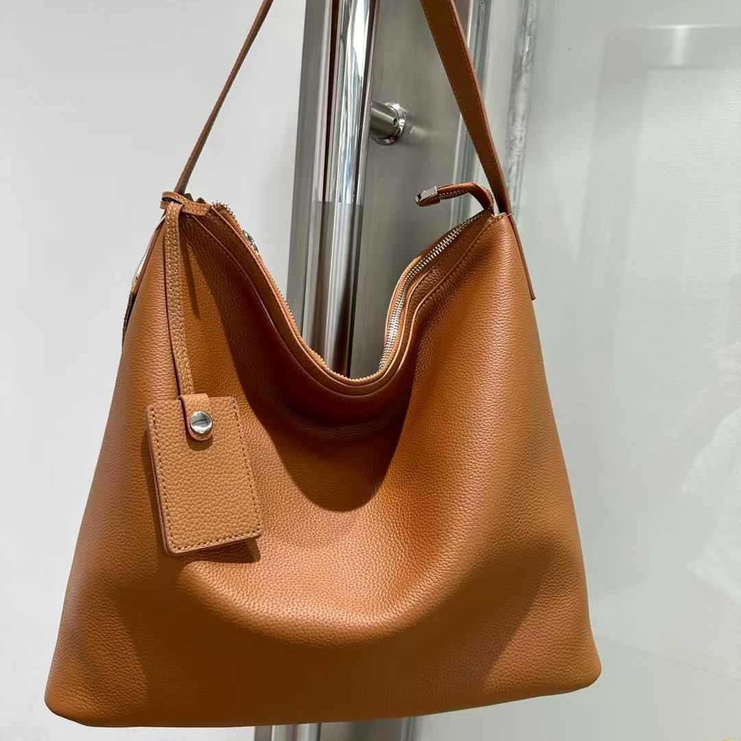 普洛克正品真皮水桶包女手提包头层牛皮休闲软皮韩版流行新款女包