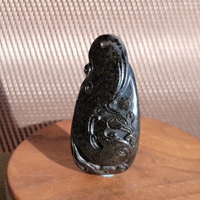 新疆的猫C122302 24.8克，老气老结油库皮仿古凤雕件