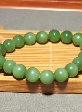 L122704 25.1克，直径9.5mm色调鲜艳肉质纯净的碧玉粉绿圆珠手链