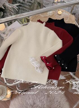 Spring韩国童装2025冬季宝宝款珍珠木耳袖口女童韩版圆领套头毛衣