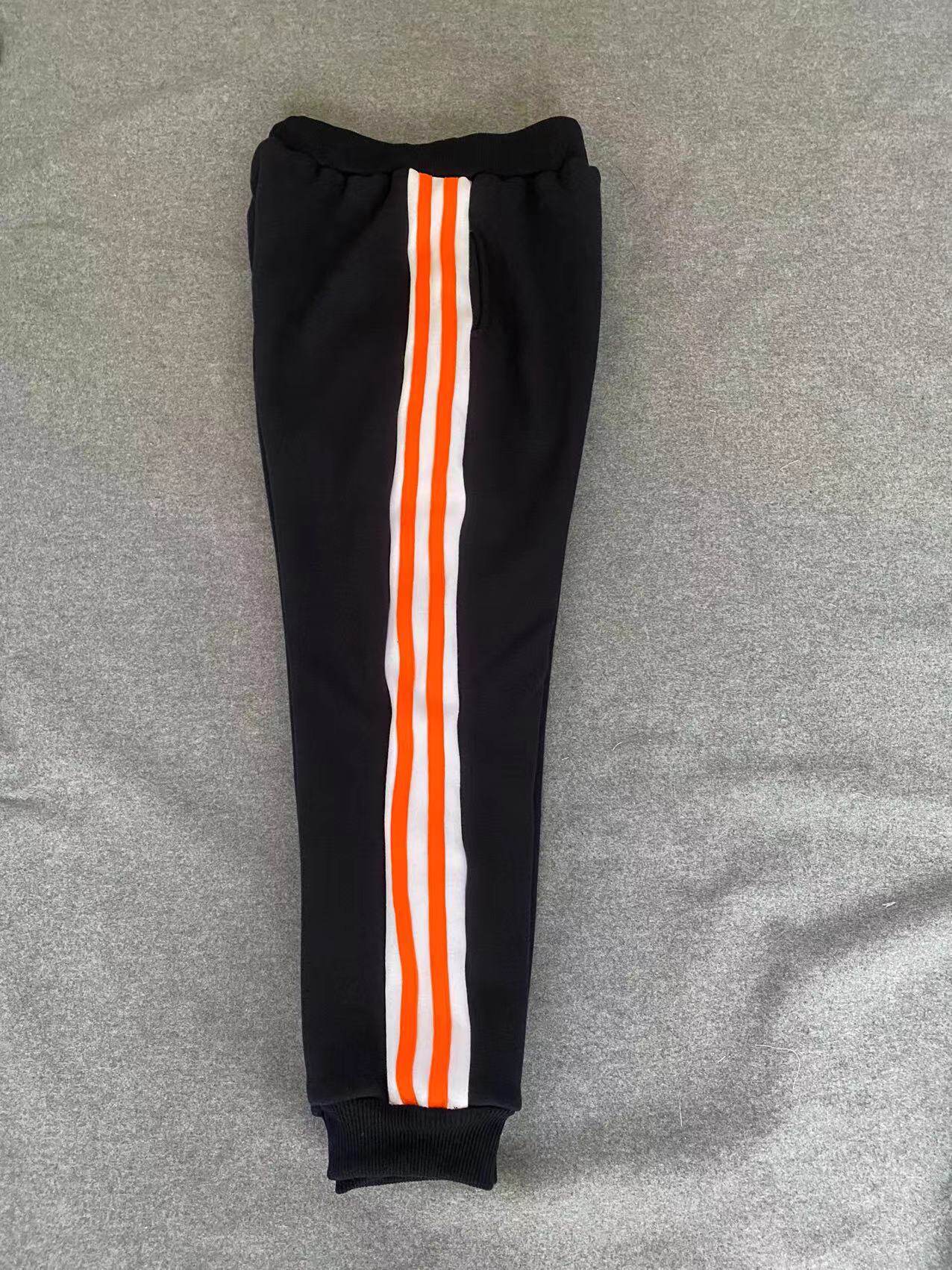 CUSTOM-MADE SPRING AUTUMN AND WINTER MENS AND WOMENS SWEATPANTS ARE SPLICED WIDE WHITE STRIPS AND 2 ORANGE RED BARS AND VELVET THICKENED COTTON SWEATPANTS