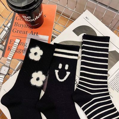 秋冬新款双针织羊绒条纹笑脸山茶花女袜柔软舒适中长筒潮袜韩版