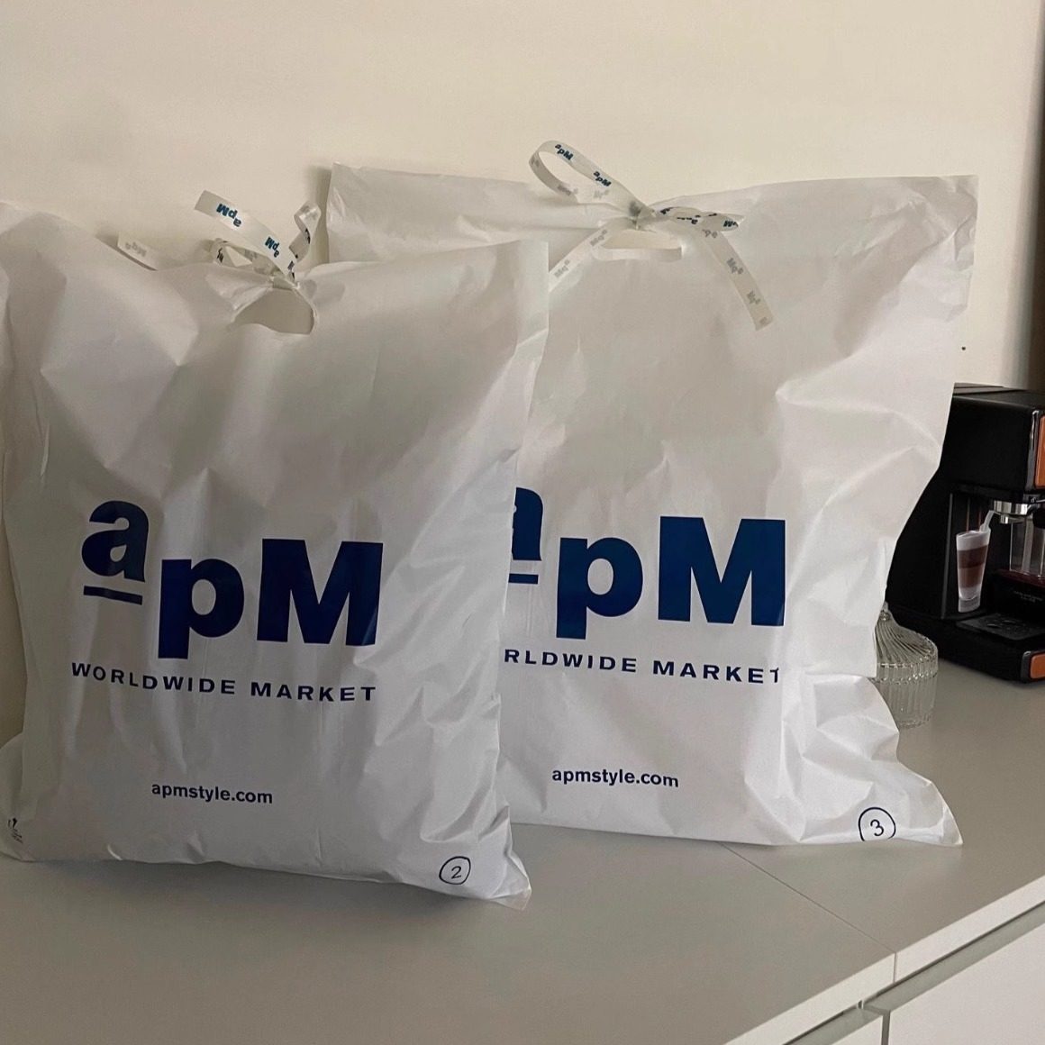 新款韩国东大门服装袋手拎购物袋塑料袋方便袋商场包装女装Apm袋