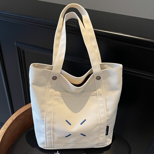 大容量托特包包女2025新款刺绣帆布上课通勤包小众百搭休闲单肩包
