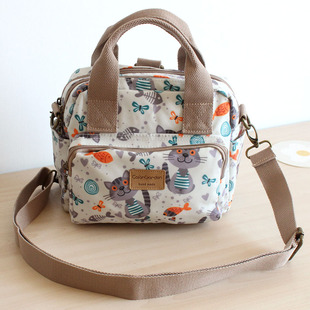 可爱图案防水牛津布多口袋实用斜挎手提双肩3用多功能包包