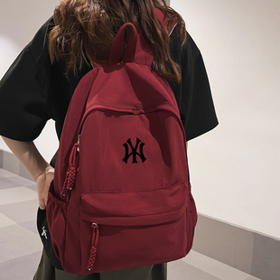 新款 书包男日系初中女生高中生大容量潮牌联名双肩背包简约纯色