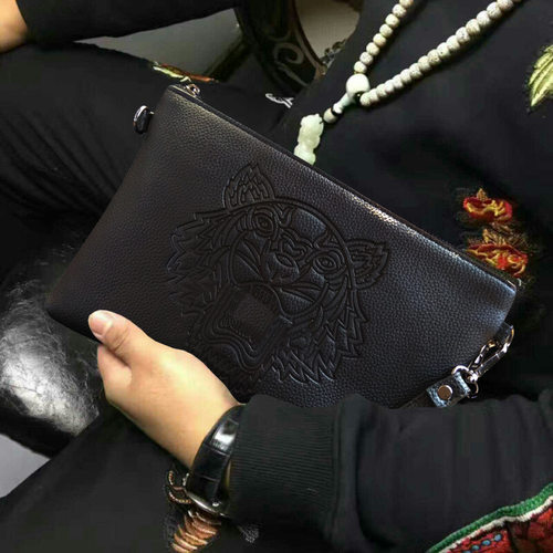 男士手包休闲pu软皮压花精神小伙