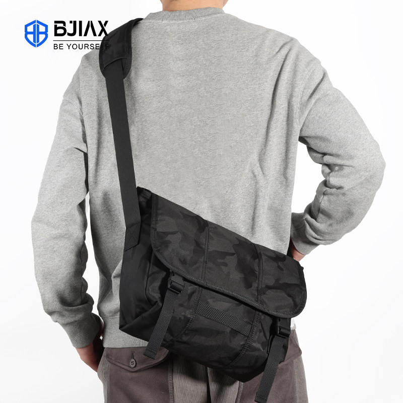 单肩包男式休闲包2024新款时尚出行轻便挎包牛津布防泼水斜挎包包