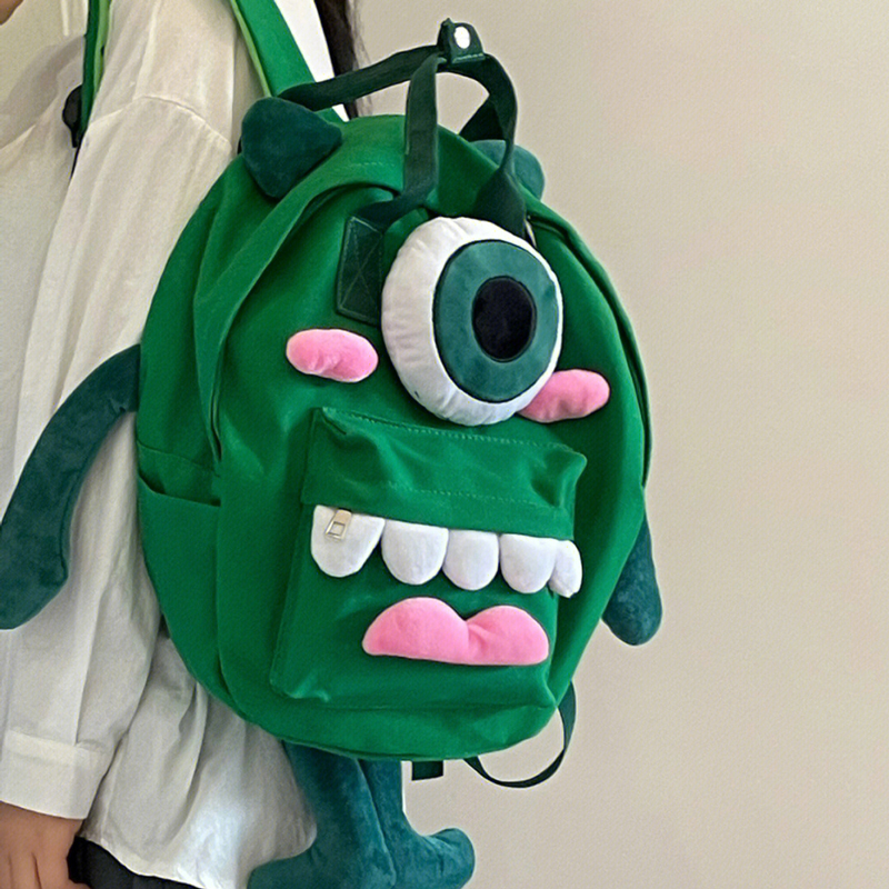 大眼仔双肩包男女丑萌帆布包
