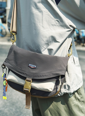 日系工装斜挎包2026新款男女轻便单肩包户外登山运动邮差包大容量
