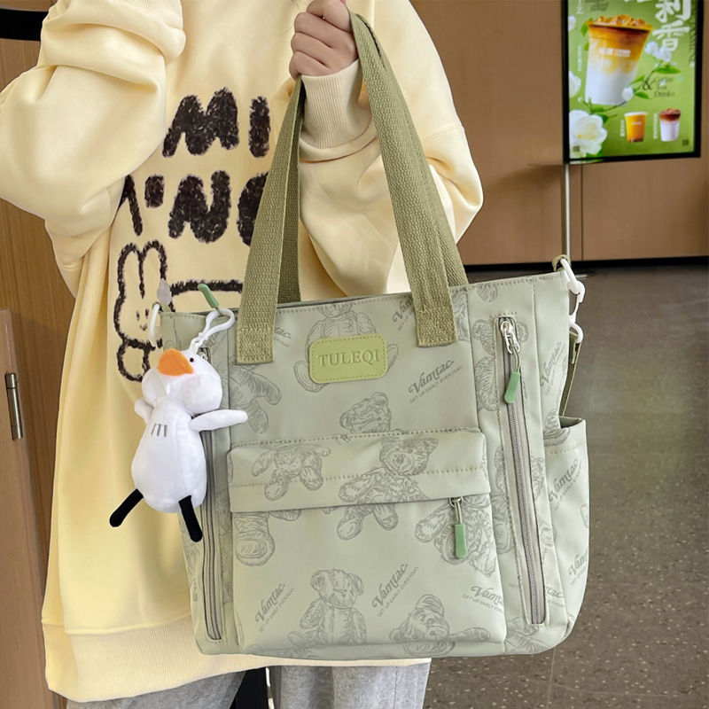 卡通印花中学生单肩包女日系休闲大容量上学补课斜挎包百搭手提包