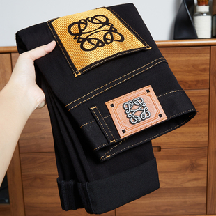 欧洲站大牌轻奢纯黑色牛仔裤男士2025新款修身小脚高端秋季裤子潮