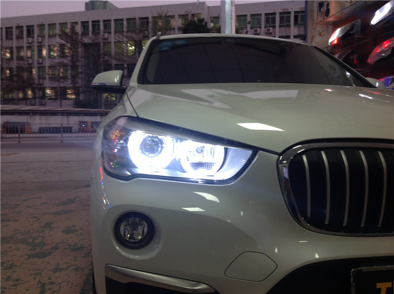 广州车灯宝马x1大灯总成白色光圈海拉双光透镜氙气led车灯天使眼