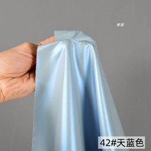 浅蓝色双色幻彩哑光膜pu皮羽绒服布料 镭射炫光变色防水防绒面料