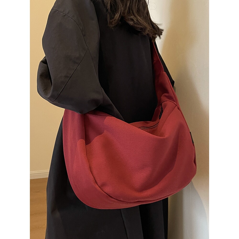 法国大容量帆布包包百搭设计感斜挎包男女大学生单肩包通勤饺子包