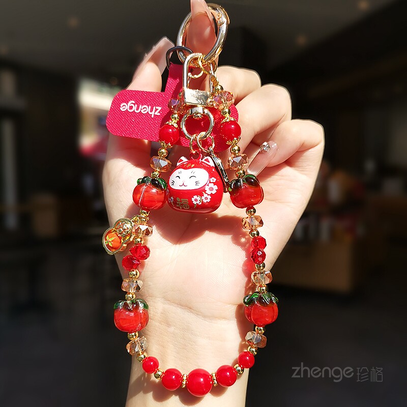 好柿花生手机链挂件手腕绳ins招财猫水音铃铛红水晶吊饰品超好看小众精致高级感户外旅游行套壳手机挂绳新款