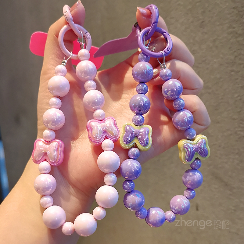 蝴蝶结糖果圆珠手机链ins可爱少女心手机壳挂件串珠手链短款手腕挂饰户外旅游逛街防丢防盗手提链手机挂绳新