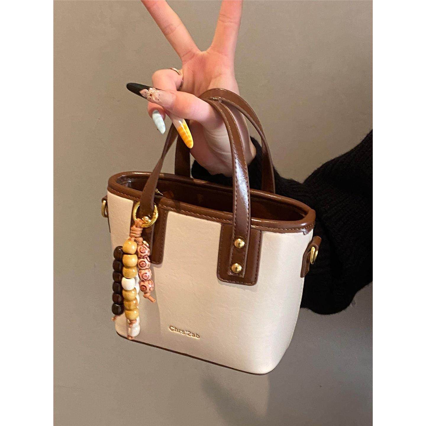 手提包包女式2026新款潮小众高级感轻奢百搭单肩包精致斜挎水桶包,箱包皮具/热销女包/男包,水桶包,淘宝优惠券,粉丝福利购,淘宝优惠卷