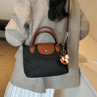 牛津布水饺包女2025新款休闲上班通勤手提包简约百搭大容量斜挎包