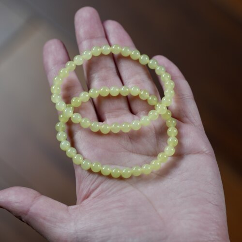 至尊暖阳。新疆若羌黄口料和田玉5.8毫米圆珠手链栗子黄 结构过灯