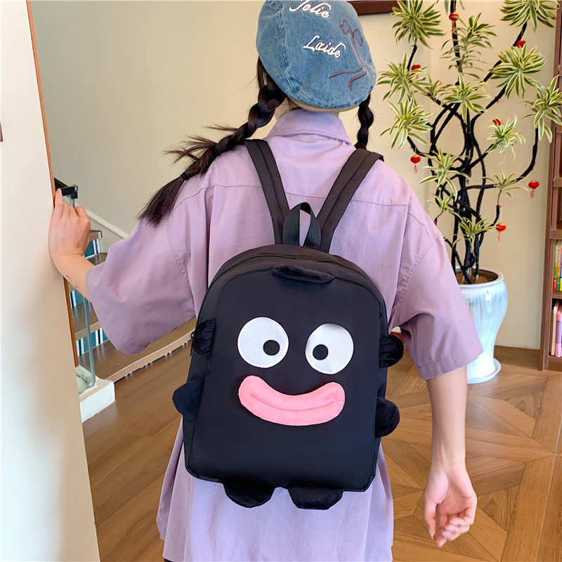 日常通勤可爱卡通双肩包女搞怪学双肩背包