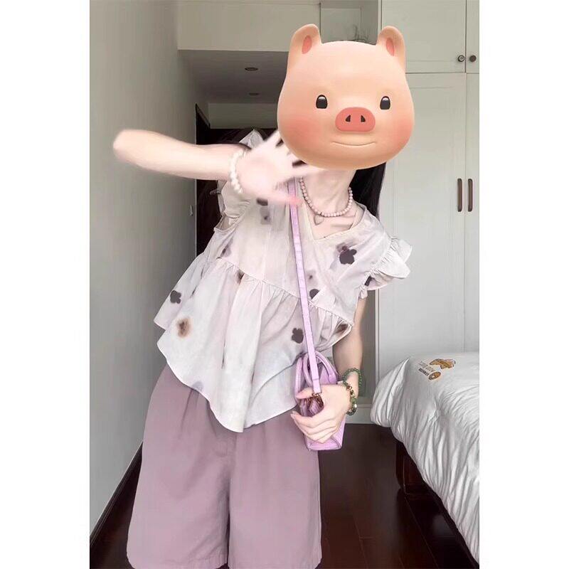 夏装多巴胺搭配一整套甜酷辣妹风穿搭女宽松上衣紫色短裤两件套装