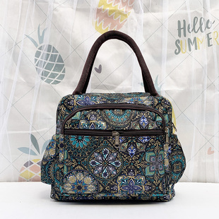 妈妈多口袋大容量手提包女士2025新款妈咪通勤外出手拎布包便当包