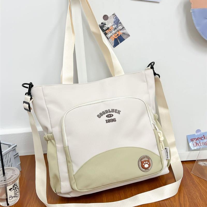 新款小学生包女大容量手提牛津布包撞色补习单肩包袋斜挎儿童包包
