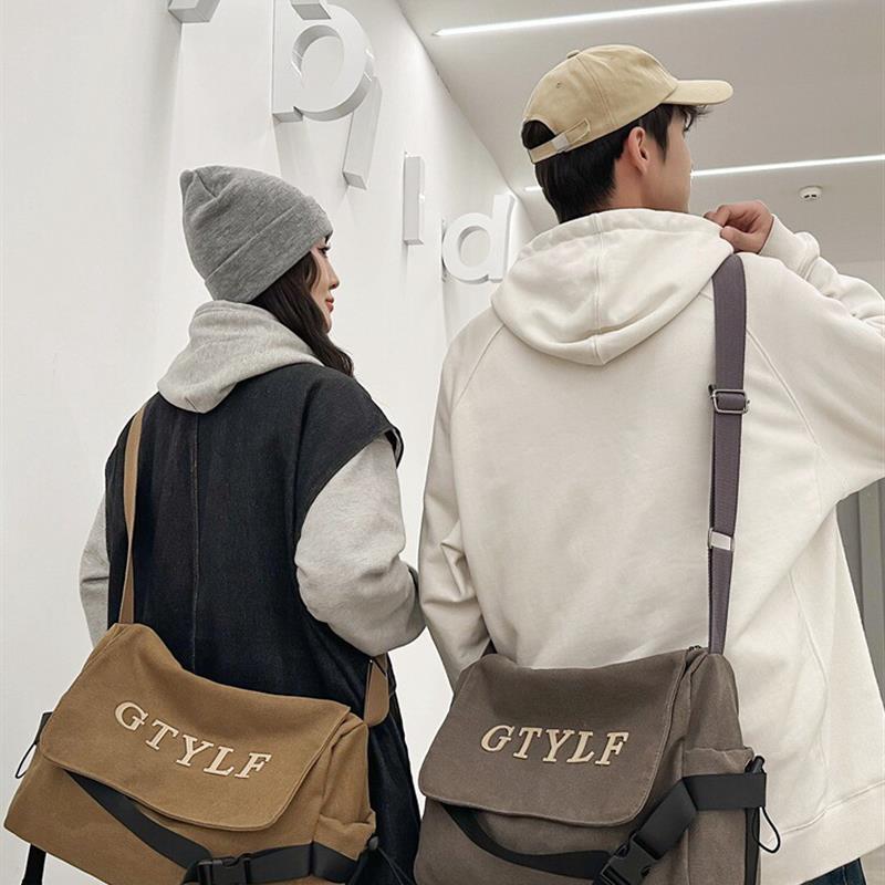 学生斜挎包男款高级感小众帆布包包大容量女时尚新款单肩包背包