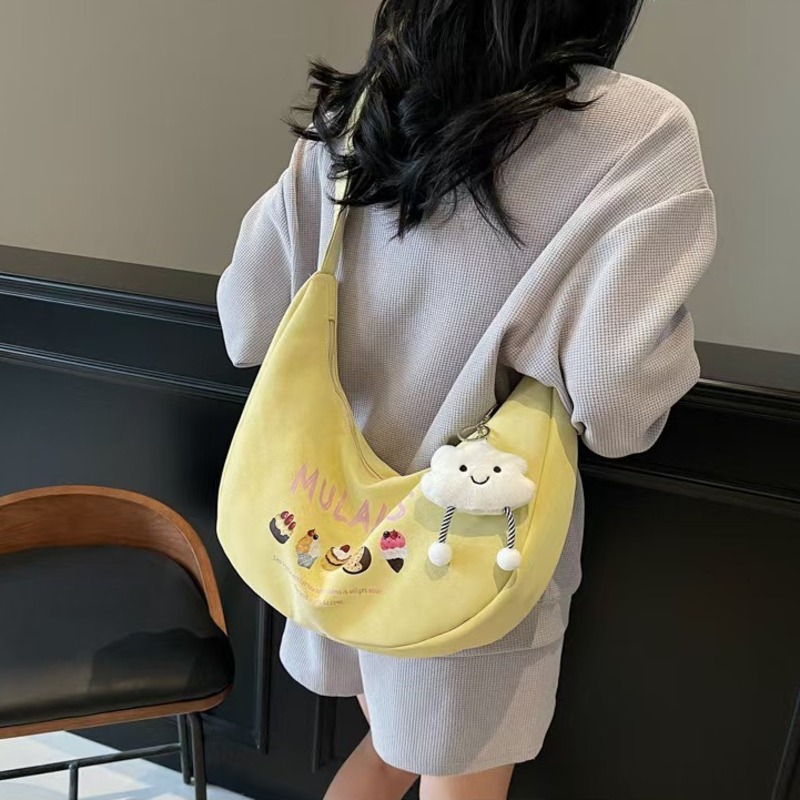 帆布包包女2025新款通勤大容量单肩包百搭斜挎包时尚超火饺子包女