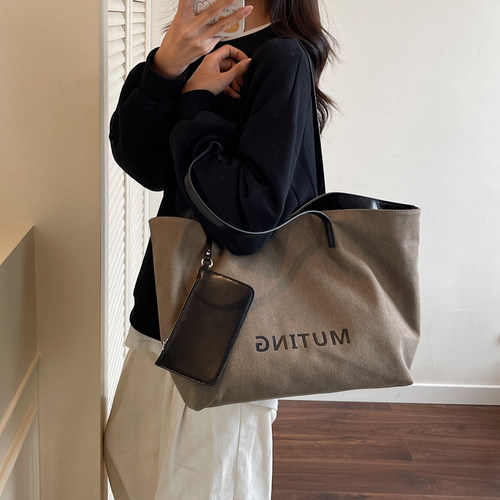 通勤大容量帆布包包女式2025新款休闲百搭单肩包大学生外出托特包