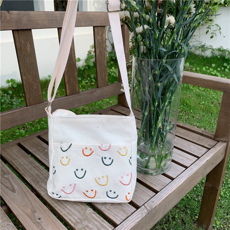 日韩可爱卡通笑脸包包刺绣简约手提斜跨包甜美少女学生手机小方包