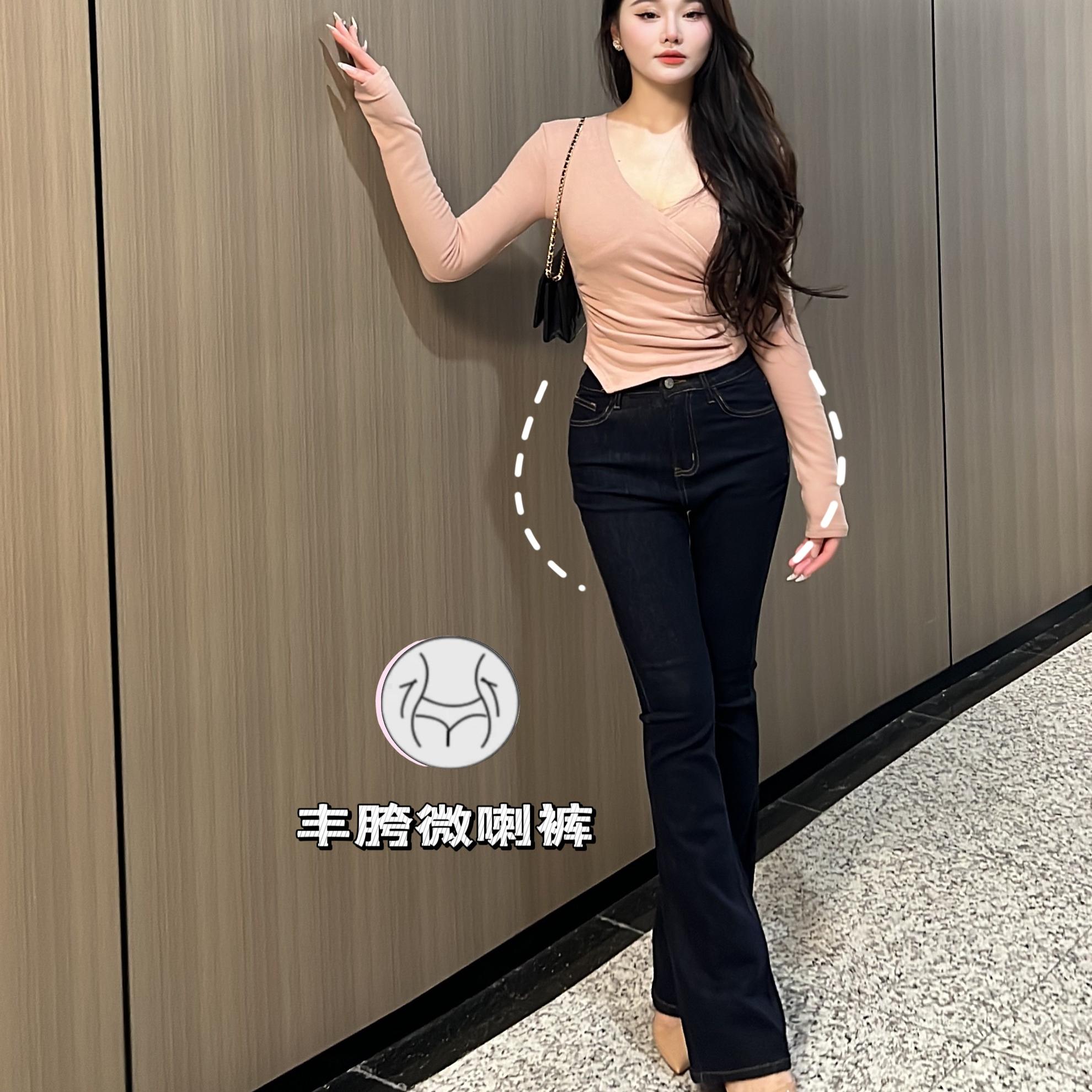 深蓝匝线丰胯牛仔微喇裤女图片