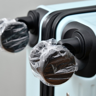 行李箱轮子防尘套旅行箱防脏滚轮轱辘座椅万向轮脚套一次性保护罩