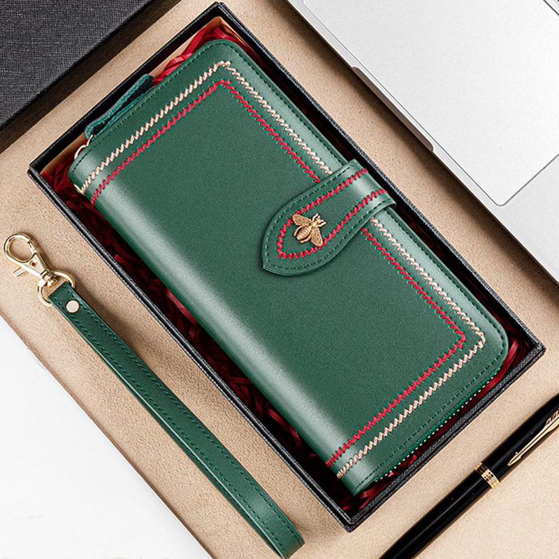 钱包女式长款牛皮搭扣钱夹青年2021新款时尚设计感真皮手拿拉链