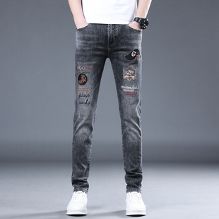 刺绣潮牌牛仔裤男士欧洲站春秋新款烟灰色修身小脚印花长裤子高端