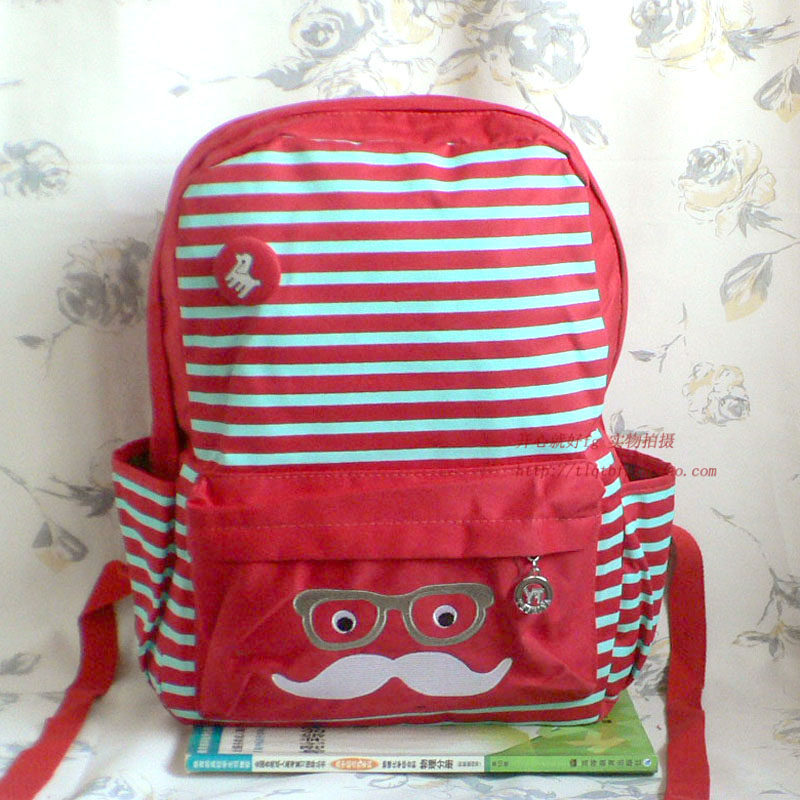 帆布小学生儿童双肩背包卡通休闲青少年印花刺秀大胡子书包痛热销