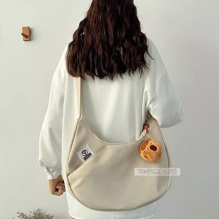 日系饺子包帆布包女时尚流行单肩包简约百搭通勤斜挎包上课书包袋,箱包皮具/热销女包/男包,时尚帆布包,淘宝优惠券,粉丝福利购,淘宝优惠卷