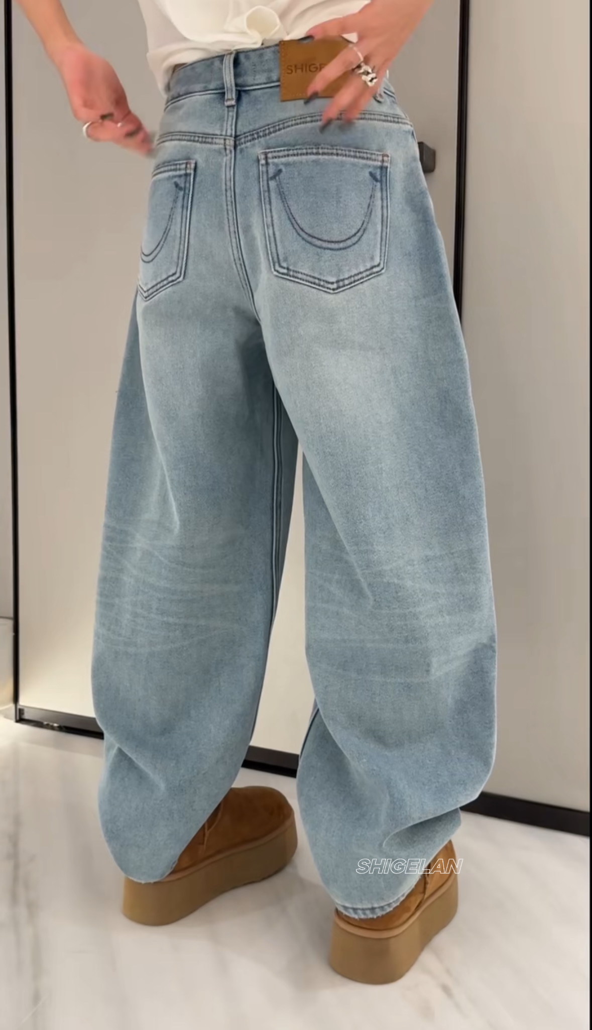 诗歌兰女装2025冬款15332百搭浅蓝色阔腿裤笑脸口袋加绒牛仔裤女