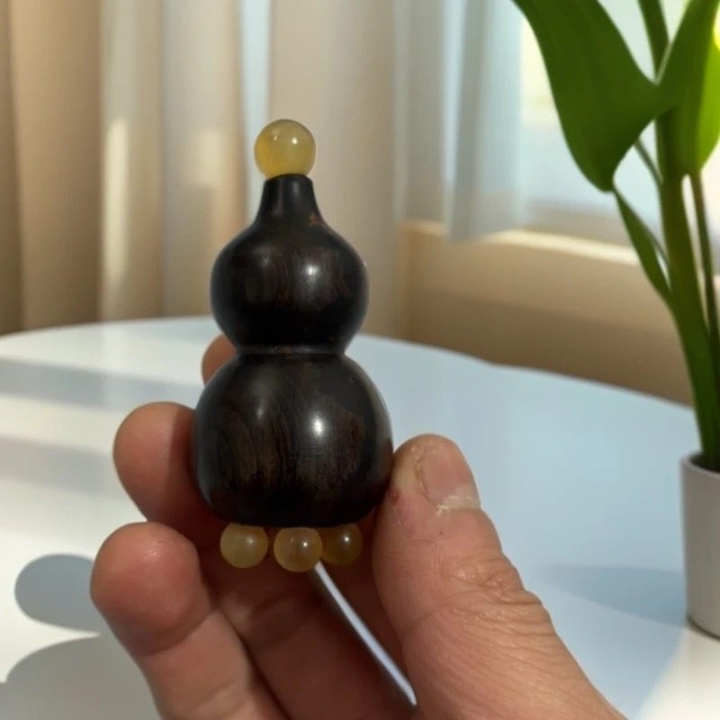 吴忠良正宗紫光檀羊角葫芦眼部按摩器随身携带手工打磨