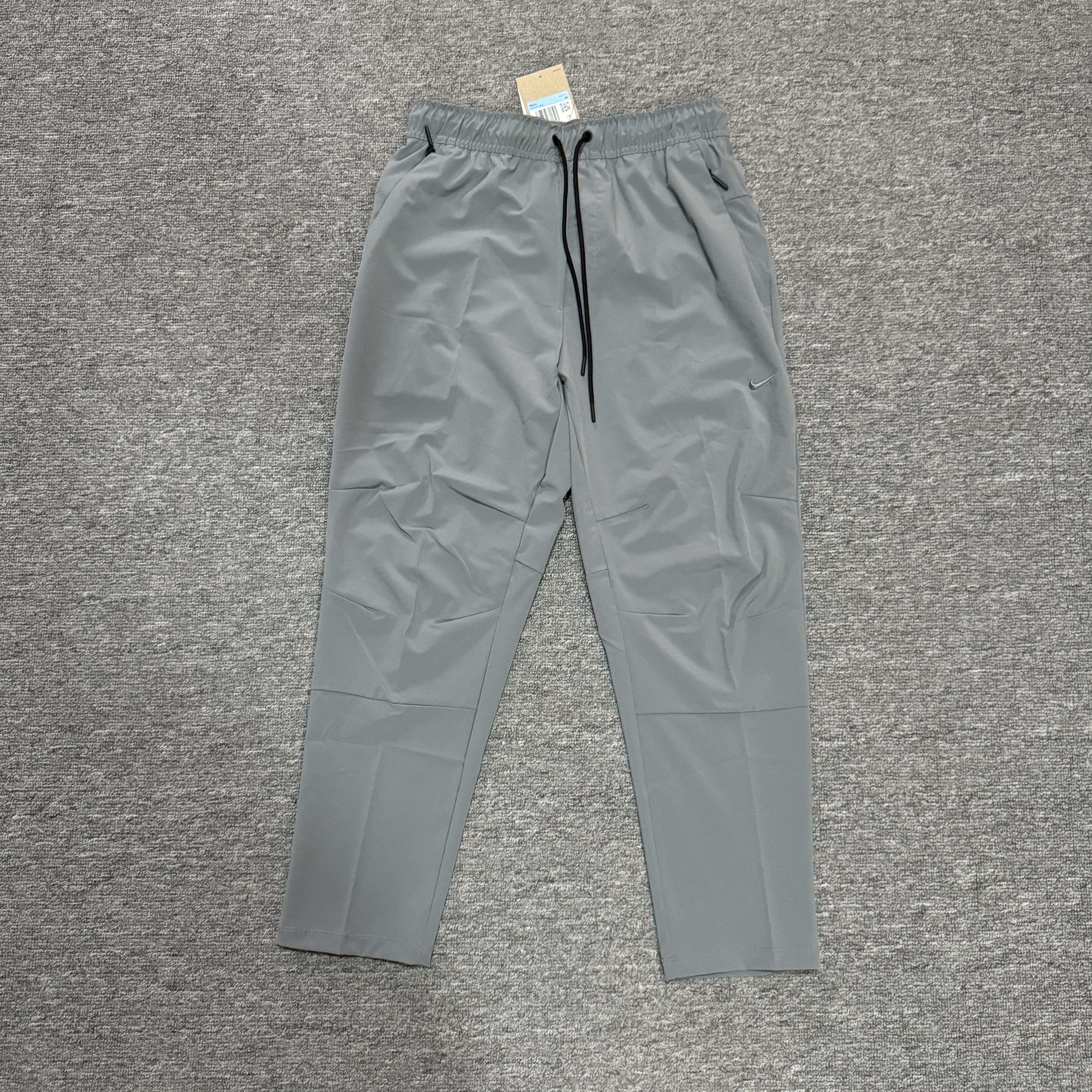 Nike/耐克 UNLIMITED 男子梭织训练锥形剪裁运动长裤 FB7547-084
