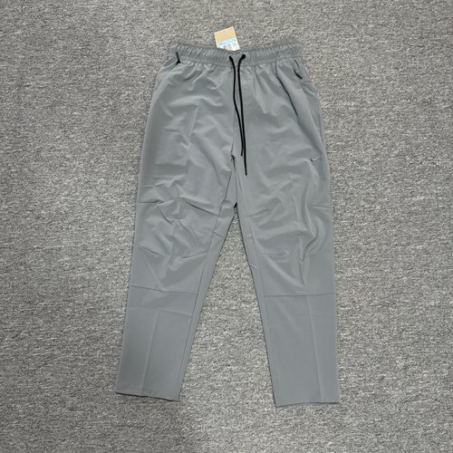 Nike/耐克 UNLIMITED 男子梭织训练锥形剪裁运动长裤 FB7547-084