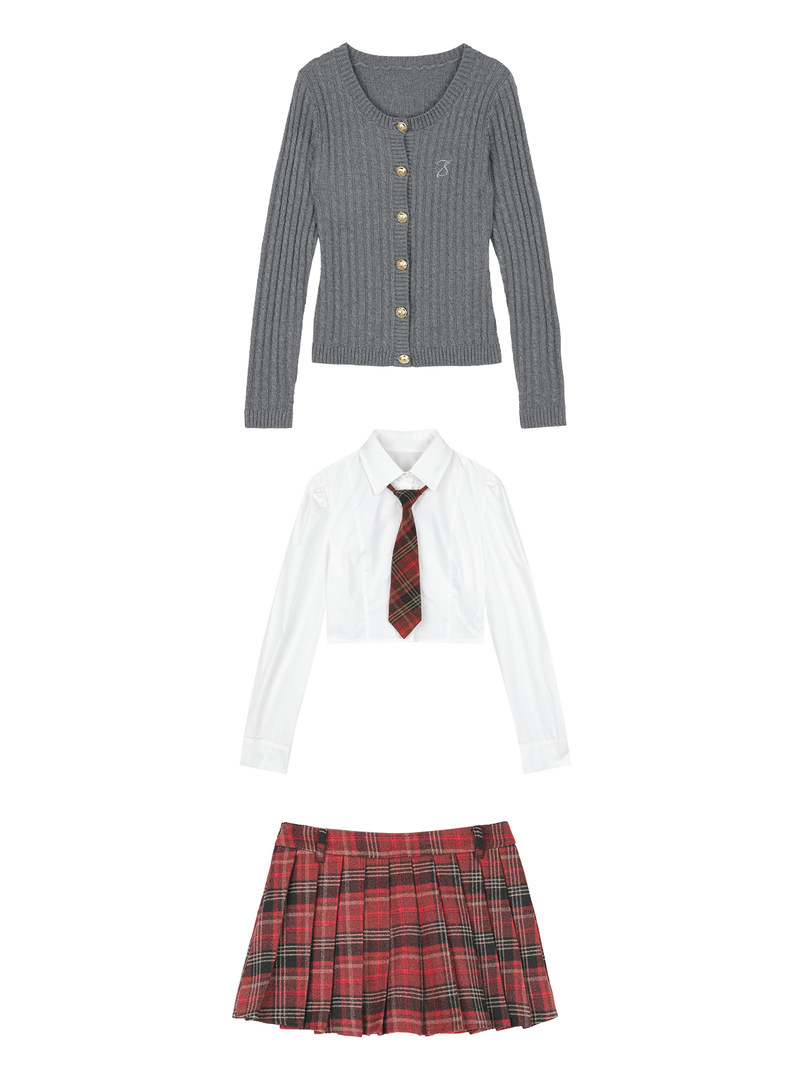 Gray cardigan, white shirt with tie, and red plaid pleated skirt laid flat on a white background