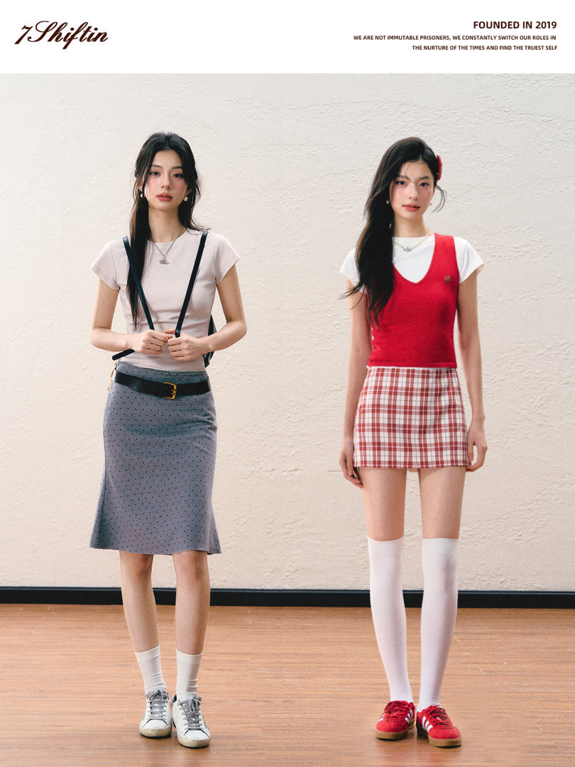Two women modeling casual short-sleeve tops and skirts