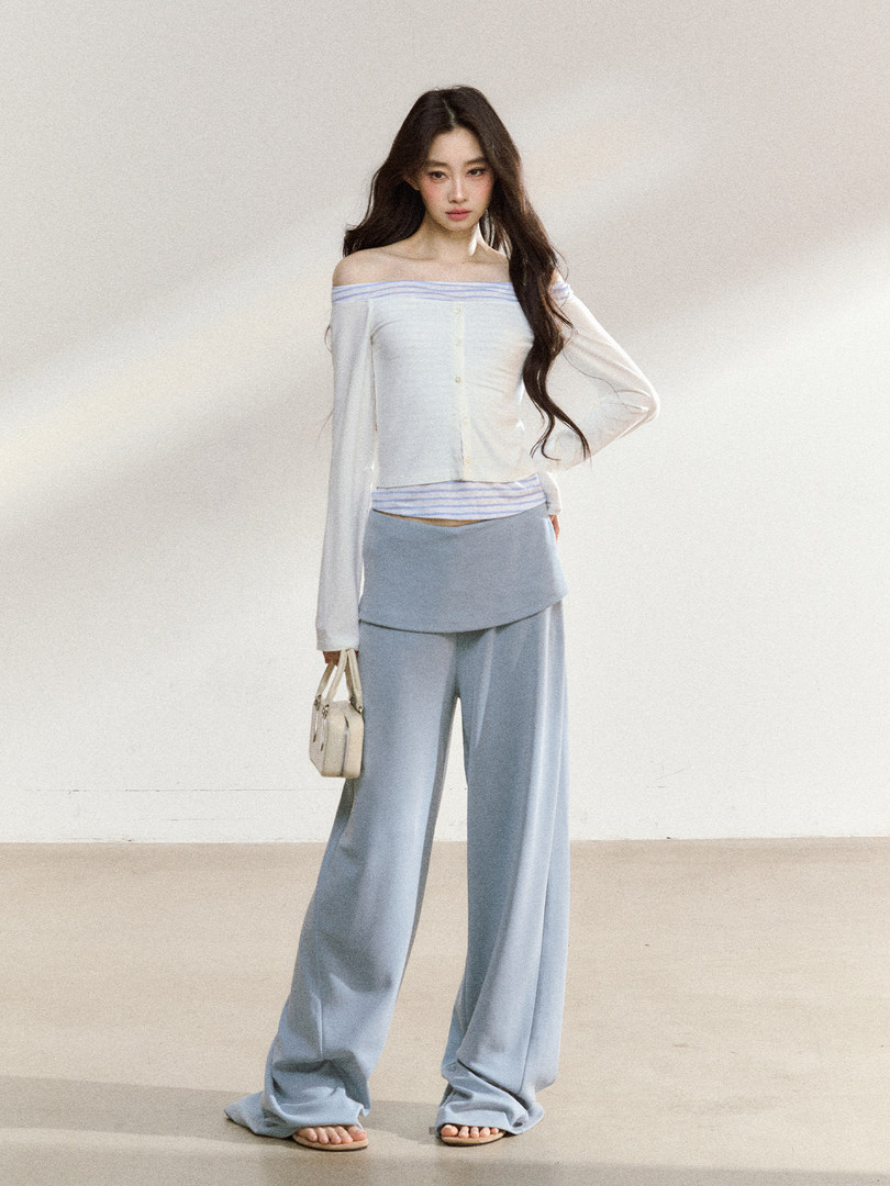 Model wearing a light blue and white off-shoulder loungewear set with wide-leg pants