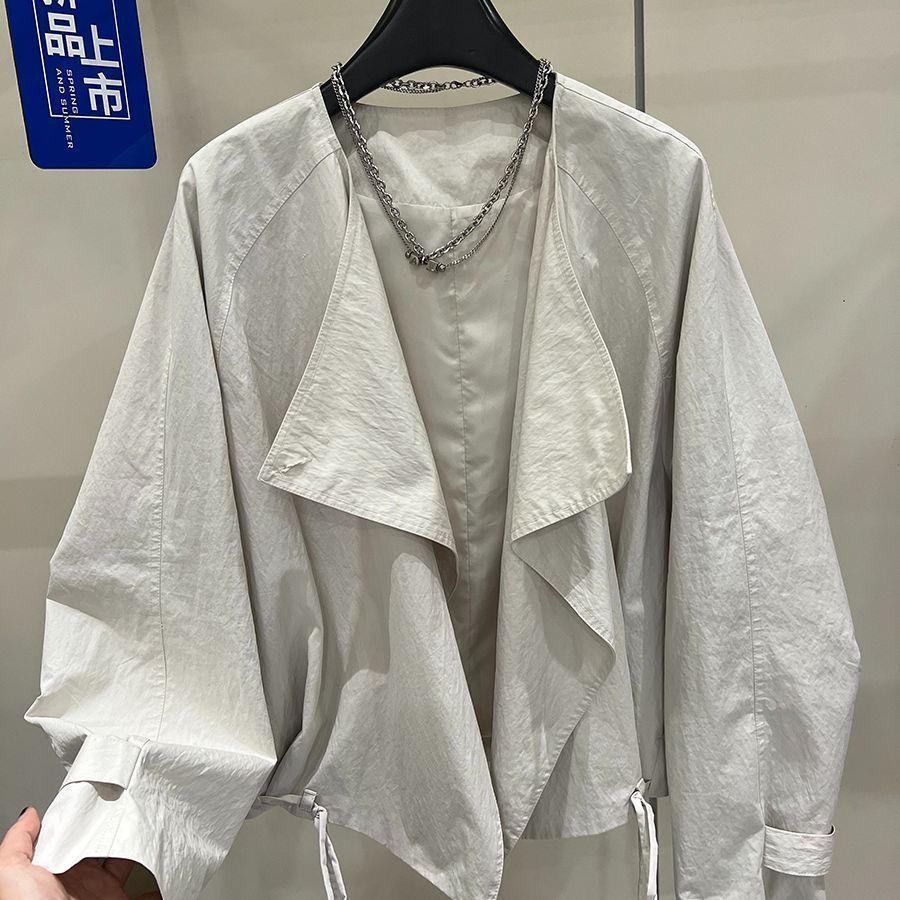 翻领纽扣韩版设计感斜门襟短外套女秋季宽松小个子通勤风夹克上衣