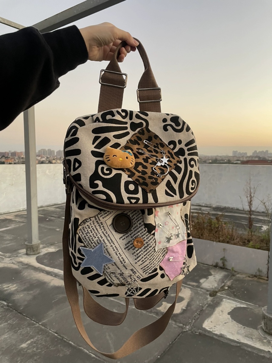 kt猫双肩包简约涂鸦多用单肩包斜跨背包新款文艺范棉麻休闲旅行包