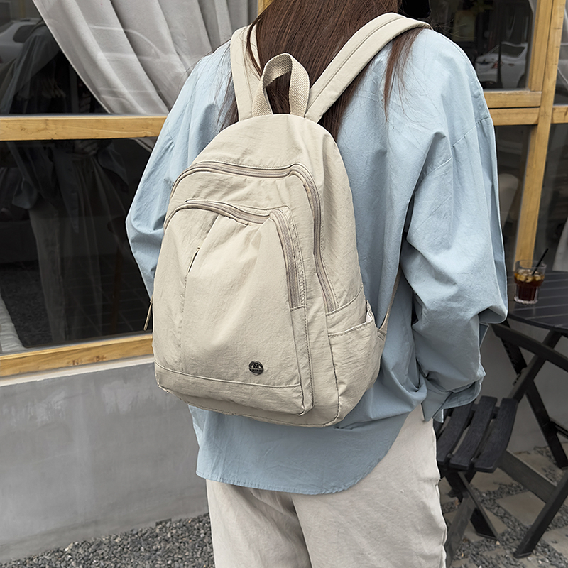轻便防水尼龙布双肩包女2025夏季新款休闲百搭牛津布旅游背包男女