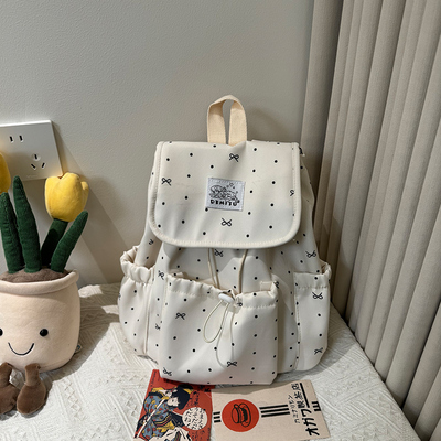 蝴蝶结波点束带双肩包女学院风大学生通勤书包小众休闲旅行小背包